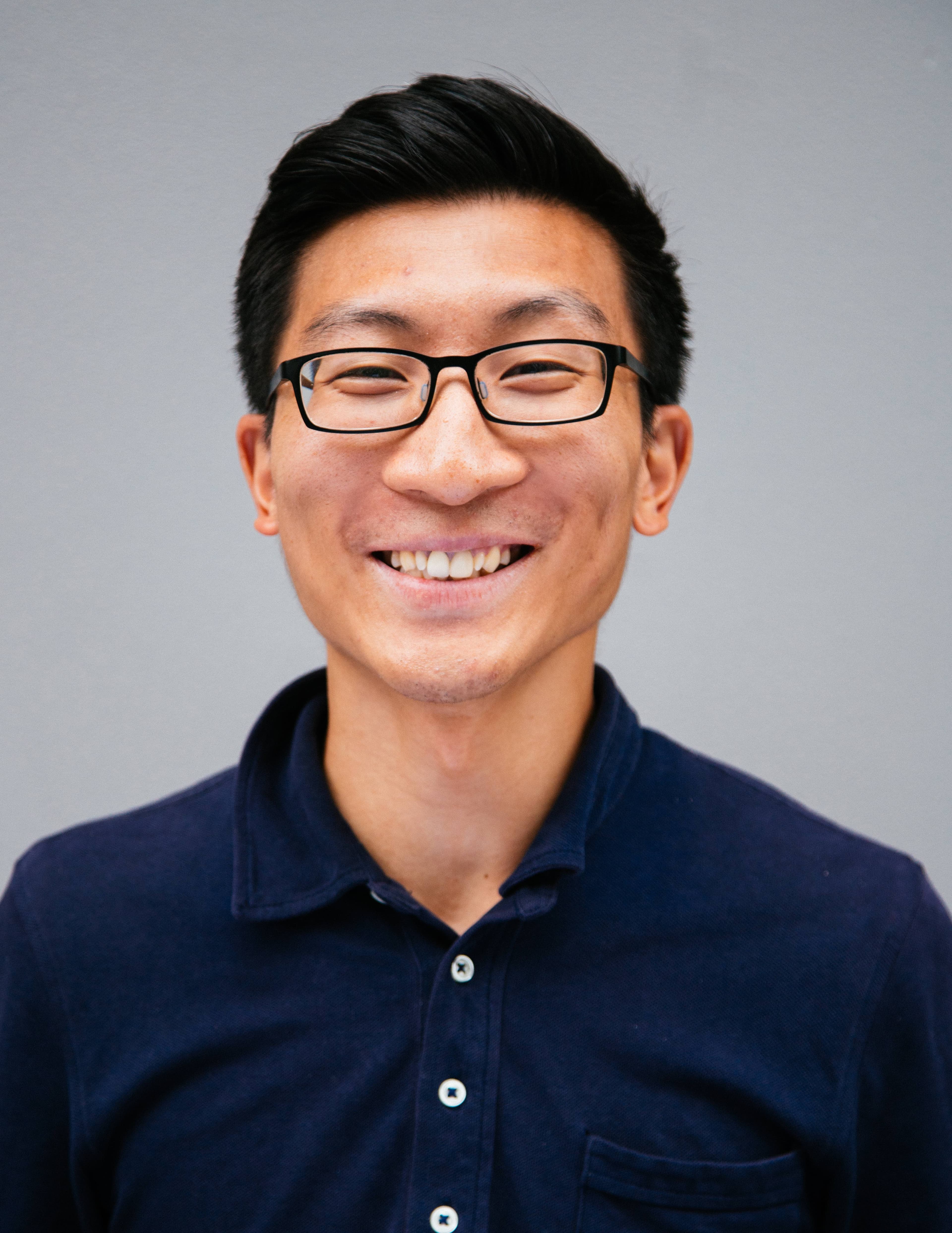 Headshot of Gee-Wey Yue, photo credit to David Tan, davidmtan.com